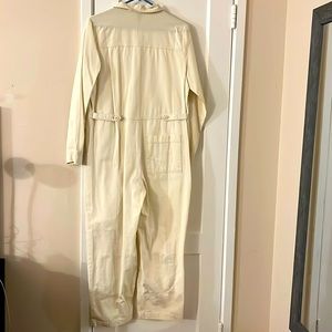 Cream one piece jumper adjustable sides.